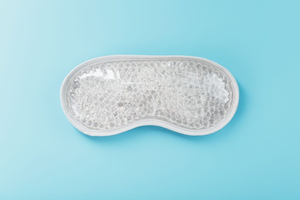 Reusable gel bead eye mask for dry eye treatment that can be heated in microwave to warm meibomian glands and improve tear film.